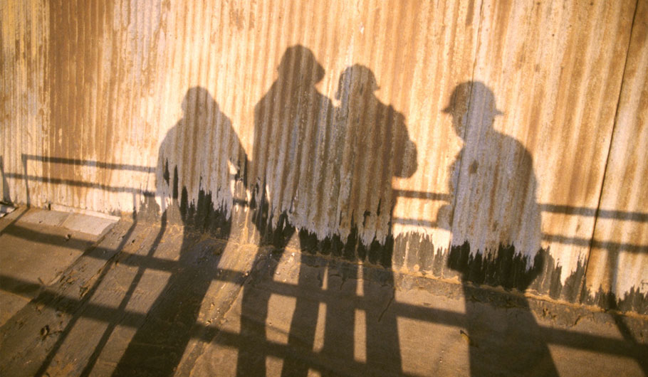 Shadows of blue-collar workers Shadows of blue-collar workers