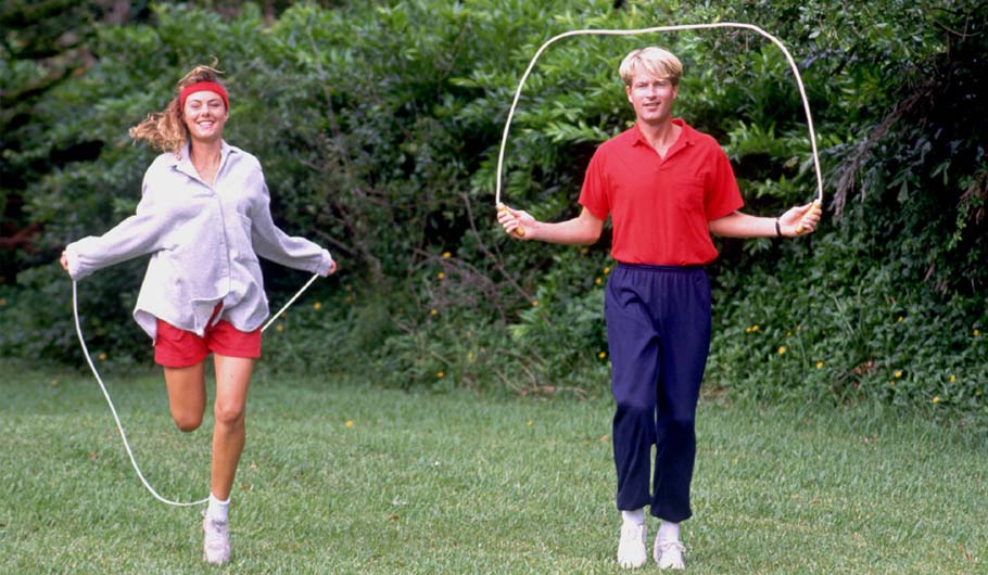 Employees excersizing by skipping rope