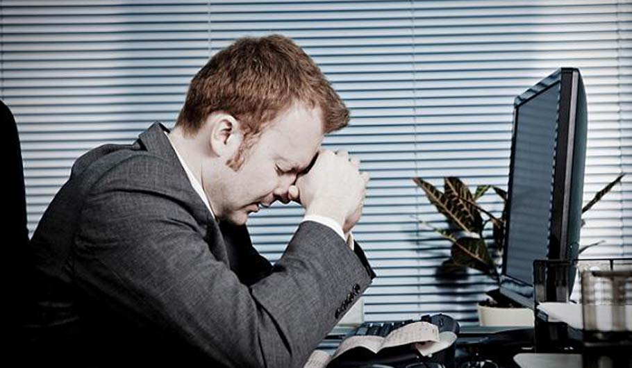 A man worried his job will be outsourced A man worried his job will be outsourced